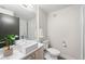 Contemporary bathroom showcasing a sleek vanity, modern sink, and a glass-enclosed shower at 1836 Grove St # 105, Denver, CO 80204