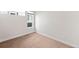 Bedroom with neutral walls and carpet, showcasing a simple yet functional layout at 1836 Grove St # 105, Denver, CO 80204