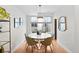 Bright dining room featuring a modern table with seating for six and natural light at 1836 Grove St # 105, Denver, CO 80204