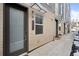 Contemporary townhome exterior with clean lines, minimalist design, and inviting covered entrances at 1836 Grove St # 105, Denver, CO 80204
