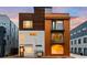 Modern home with a unique facade, showcasing a blend of wood, concrete, and metal accents at 1836 Grove St # 105, Denver, CO 80204