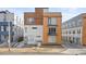 Modern townhome showcasing contemporary architecture with wood and metal accents, plus convenient street access and easy parking at 1836 Grove St # 105, Denver, CO 80204