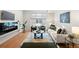 Cozy living room featuring a modern fireplace, plush seating, and stylish decor at 1836 Grove St # 105, Denver, CO 80204