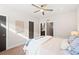 Spacious main bedroom featuring a ceiling fan and neutral décor at 1836 Grove St # 105, Denver, CO 80204
