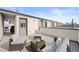 Relaxing rooftop patio with comfortable seating, perfect for enjoying outdoor living at 1836 Grove St # 105, Denver, CO 80204