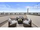 Charming rooftop patio featuring cozy furniture, ideal for entertaining or relaxation at 1836 Grove St # 105, Denver, CO 80204