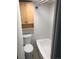 This cozy bathroom is equipped with a tub and storage cabinet above the toilet at 200 N Pearl St # 205, Denver, CO 80203