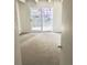 Bedroom featuring neutral carpeting and large glass doors opening to the outdoors at 200 N Pearl St # 205, Denver, CO 80203