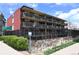 Building exterior showing multiple balconies and updated black fencing at 200 N Pearl St # 205, Denver, CO 80203