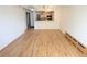 Spacious open-concept living space with hardwood floors, kitchen view, and natural light at 200 N Pearl St # 205, Denver, CO 80203