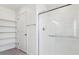 Bright bathroom features a large glass shower and built-in shelving for ample storage at 1038 Scotts Peak Dr, Berthoud, CO 80513