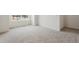 Bright, carpeted bedroom filled with natural light through a large window, creating a cozy atmosphere at 1038 Scotts Peak Dr, Berthoud, CO 80513