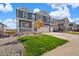 Charming home featuring a well-kept lawn, rock landscaping, and a convenient three-car garage at 1038 Scotts Peak Dr, Berthoud, CO 80513