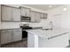 Beautiful kitchen with gray cabinets, stainless steel appliances, and granite countertops at 1038 Scotts Peak Dr, Berthoud, CO 80513