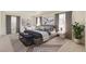 Calming main bedroom with carpeted floor, stylish decor, and light from large windows at 1038 Scotts Peak Dr, Berthoud, CO 80513