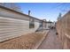 Long gravel backyard with wooden fence at 2017 Tulane St, Denver, CO 80260