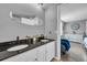 Bathroom with double vanity and dark countertops at 2017 Tulane St, Denver, CO 80260