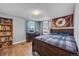 Spacious bedroom with hardwood floors and large windows at 2017 Tulane St, Denver, CO 80260