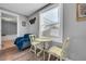 Small dining area with a table and two chairs near bedroom at 2017 Tulane St, Denver, CO 80260