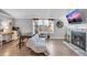 Living area with wood floors, fireplace, and home office at 2017 Tulane St, Denver, CO 80260