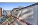 Landscaped walkway leading to the side of the house with small garden at 2017 Tulane St, Denver, CO 80260