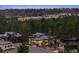 Serene aerial view of a neighborhood nestled among lush green trees, showcasing the architectural style of homes at 1207 Wildcat Bend Ct, Castle Rock, CO 80108