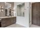 Bright bathroom features modern vanity, decorative wall tile, and glass enclosed shower at 1207 Wildcat Bend Ct, Castle Rock, CO 80108