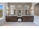 Bright bathroom features double vanities, decorative wall tile, and a makeup vanity with stool at 1207 Wildcat Bend Ct, Castle Rock, CO 80108