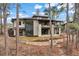 Beautiful multi-level home with stone accents, multiple decks, and manicured landscaping at 1207 Wildcat Bend Ct, Castle Rock, CO 80108