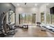 Bright and airy gym with large windows showcasing the surrounding nature and outdoor views at 1207 Wildcat Bend Ct, Castle Rock, CO 80108