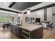 Kitchen island with oven overlooks open floor plan, featuring a dining area and fireplace in the living room at 1207 Wildcat Bend Ct, Castle Rock, CO 80108