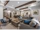 A spacious living room with exposed beam ceilings and an adjacent wet bar, perfect for entertaining guests at 1207 Wildcat Bend Ct, Castle Rock, CO 80108