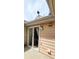 Tan back patio with sliding glass doors and access to the interior at 1748 Eagle St # B, Aurora, CO 80011