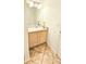 Bathroom featuring a single sink vanity with wood cabinets and tile floors at 1748 Eagle St # B, Aurora, CO 80011