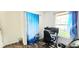 Bedroom has a computer desk near a window, and a curtain with a plane on it at 1748 Eagle St # B, Aurora, CO 80011