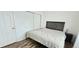 Cozy bedroom with laminate floors, closet with bi-fold doors, and queen-sized bed at 1748 Eagle St # B, Aurora, CO 80011