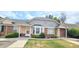 Welcoming townhome exterior with brick accents and manicured landscaping at 1748 Eagle St # B, Aurora, CO 80011