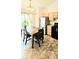 Eat-in kitchen featuring stainless steel appliances, dining table, and sliding door to the exterior at 1748 Eagle St # B, Aurora, CO 80011