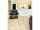 Spacious living area with tile floors, open to kitchen, ideal for entertaining at 1748 Eagle St # B, Aurora, CO 80011