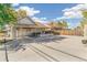 Large concrete backyard with covered patio area at 172 S Lowell Blvd, Denver, CO 80219