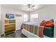 Bright bedroom with wood floors and a ceiling fan at 172 S Lowell Blvd, Denver, CO 80219