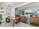 Bright dining area with built-in shelving and hardwood floors at 172 S Lowell Blvd, Denver, CO 80219