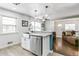 Updated kitchen featuring a farmhouse sink and breakfast bar at 172 S Lowell Blvd, Denver, CO 80219