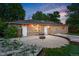 Brick house with large backyard featuring a fire pit and landscaping at 981 Ursula St, Aurora, CO 80011