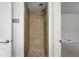Tiled shower with decorative tile accents, and modern fixtures at 981 Ursula St, Aurora, CO 80011