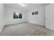 Bright bedroom with neutral carpet, window, and white trim at 981 Ursula St, Aurora, CO 80011