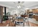 Cozy dining room showcasing hardwood floors, an open floor plan, and seamless flow to the kitchen and living area at 981 Ursula St, Aurora, CO 80011