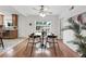 Dining area with hardwood floors, a modern ceiling fan, and direct access to the kitchen and backyard at 981 Ursula St, Aurora, CO 80011