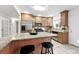 This beautiful kitchen features stainless steel appliances and a large center island with barstool seating at 981 Ursula St, Aurora, CO 80011