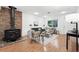 Bright living room with hardwood floors, brick fireplace, and neutral-toned furniture creating a cozy atmosphere at 981 Ursula St, Aurora, CO 80011
